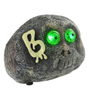 Teschio a Forma Pietra per Halloween con Occhi a LED Verdi